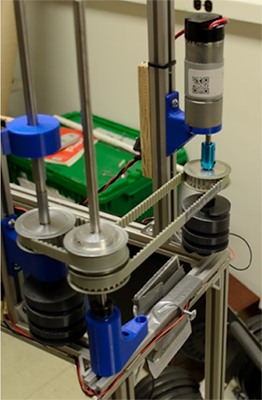 An image showing the motor and timing belt setup used to drive the cams